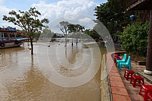 View of a flooded street in downtown Hoi An, Vietnam along the Thu Bon River during the 2021 rainy season