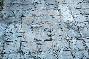 View of flooring grout and glue after removing old tiles during renovation work