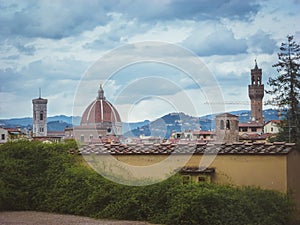 View of Florence Cathedral from Boboli Gardens in Florence, Italy with a cloudy sky