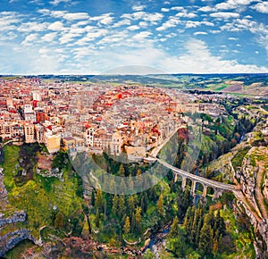 View from flying drone. Aerial morning cityscape of Gravina in Puglia tovn.