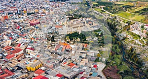 View from flying drone. Aerial morning cityscape of Gravina in Puglia tovn. Attractive spring landscape of Apulia, Italy, Europe.