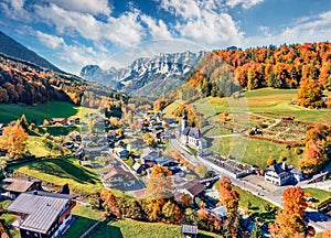 View from flying drone. Astonishing morning scene of Parish Church of St. Sebastian. Bright autumn view of Bavarian Alps, Ramsau b