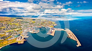 View from flying drone. Breathtaking summer sityscape of Torshavn town. Aerial morning scene of Streymoy island, Faroe, Kingdom of