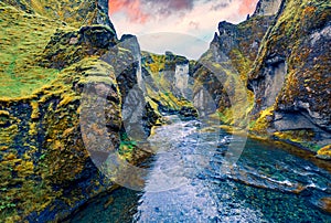 View from flying drone of Fjadrargljufur canyon and river. Dramatic summer sunrise on South east Iceland, Europe.