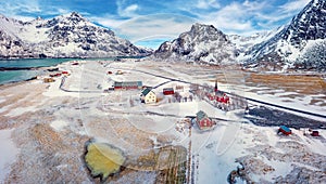 View from flying drone of Flakstad village with Hustinden mount on background, Norway, Europe. photo