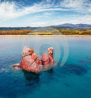 View from flying drone. Gorgeous summer view of di Cea beach with Red Rocks Gli Scogli Rossi - Faraglioni. photo