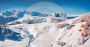 View from flying drone of Italian ski resort. Bright morning view of Dolomite Alps.