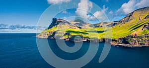 View from flying drone. Panoramic morning scene of Mulafossur Waterfall. Fantastic summer view of Vagar island, Faroe Islands, Den