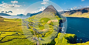 View from flying drone. Perfect summer scene of Vidareidi village, Vidoy island. Wonderful morning view of Faroe Islands, Kingdom