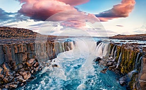 View from flying drone of Selfoss Waterfall. Incredible summer sunrise on Jokulsa a Fjollum river, Jokulsargljufur National Park.