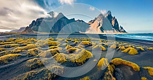 View from flying drone. Spectacular autumn scene of Stokksnes cape with Vestrahorn Batman Mountain on background. Panoramic Icel