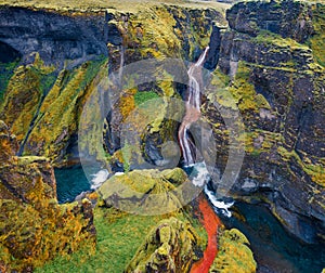 View from flying drone of waterfall in Fjadrargljufur canyon. Impressive summer scene of South east Iceland, Europe. Beauty of nat