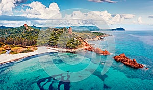 View from flying drone. Wonderful summer view of di Cea beach with Red Rocks Gli Scogli Rossi - Faraglioni. Aerial morning scene o photo