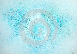 View of foam after dissolving color bath bomb in water