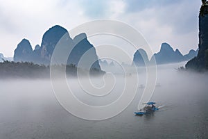 view of fog with ships on river near Xingping town