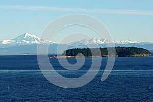 View form the container ship on the mountain covered with snow surrounding approach to Vancouver, British Columbia,  from Pacific