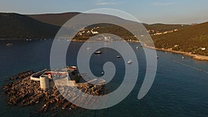 View of the fort on the Mamula island, yachts in the bay, Lustitsa peninsula and Arza fortress