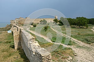 View of fortified wall and watchtower of middle stronghold in old turkish fortress