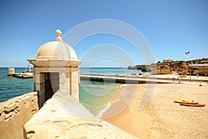 View from fortress Forte da Ponta da Bandeira in Lagos to waterfront with beach Praia da Batata, Algarve photo