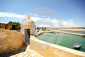 View from fortress Forte da Ponta da Bandeira in Lagos to waterfront with marina and old town, Algarve photo