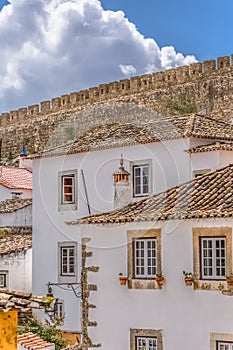 View of the fortress and Luso Roman castle of Ã“bidos, with buildings of Portuguese vernacular architecture and s