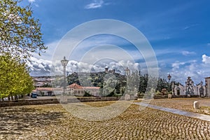 View of the fortress and Luso Roman castle of Ã“bidos, with buildings of Portuguese vernacular architecture and sky with clouds,