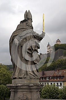 View of Fortress Marienberg with 18th century statue of St. Burkardus in foreground photo