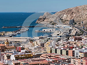 View from the fortress of Moorish houses and buildings along the port of Almeria, Andalusia, Spain