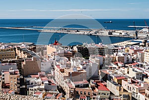 View from the fortress of Moorish houses and buildings along the port of Almeria, Spain