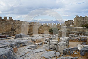 View of the fortress wall, west wing of the Hellenistic stoa and Knights Headquarters on the Acropolis of Lindos.