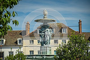 View of the fountain place saint jean in the city of Melun photo