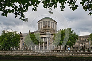 View of the Four Courts along th river Liffey in downtown Dublin Ireland