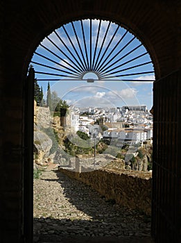 View framed by the gate on the pueblo blanco Ronda, Malaga Province, Andalucia, Spain, Europe