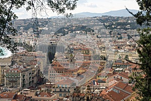 View of the French city of Nice from the observation deck of the fortress. Mountains, sky and rooftops