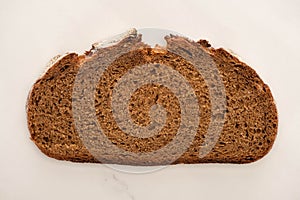 View of fresh brown bread slice on white background