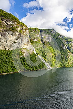 View on Friarfossen waterfall in Geiranger fjord from cruise ship in summer