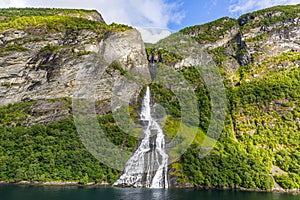 View on Friarfossen waterfall in Geiranger fjord from cruise ship in summer