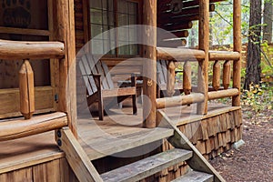 View of Front Porch of Rustic Log Cabin in the Woods