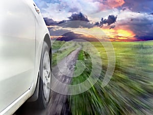 View of the front of a silver car while driving fast