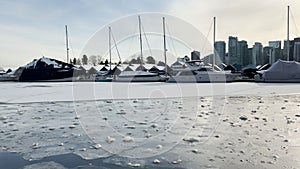 A View of frozen dock with boats in Coal Harbour