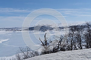 View of the frozen lake SlÃÂ¸ddfjorden near the village of HaugastÃÂ¸l, in the municipality of Hol, Viken County, Norway, photo