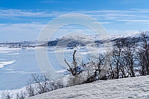 View of the frozen lake SlÃÂ¸ddfjorden near the village of HaugastÃÂ¸l, in the municipality of Hol, Viken County, Norway photo