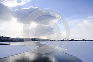 View of the frozen Neva River in St. Petersburg, opening up from the ice