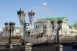 View through a gallery with retro lanterns on a historic building in Yekaterinburg, Russia