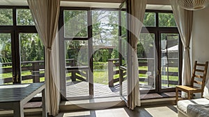 View of garden from inside house with french doors leading to a courtyard garden. View through the window on garden.