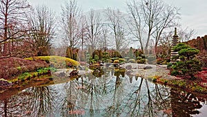 View through garden pavillion at Japanese garden pond in Bonn Germany