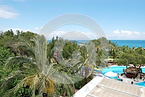 View of the garden, pool and the sea on the Mediterranean resort