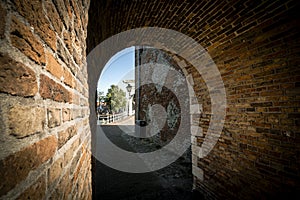 View through the gate and passage in the medieval city wall from the Zuidhavenpoort to the city harbor of Zierikzee