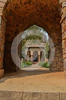 A view from the gate of sikandar lodhi monument at lodi garden or lodhi gardens in a city park from the side of the lawn at winter