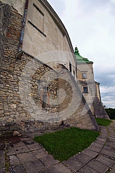 View of Gate and wall in ancient Olesko castle. Lviv region in Ukraine. Cloudy summer day